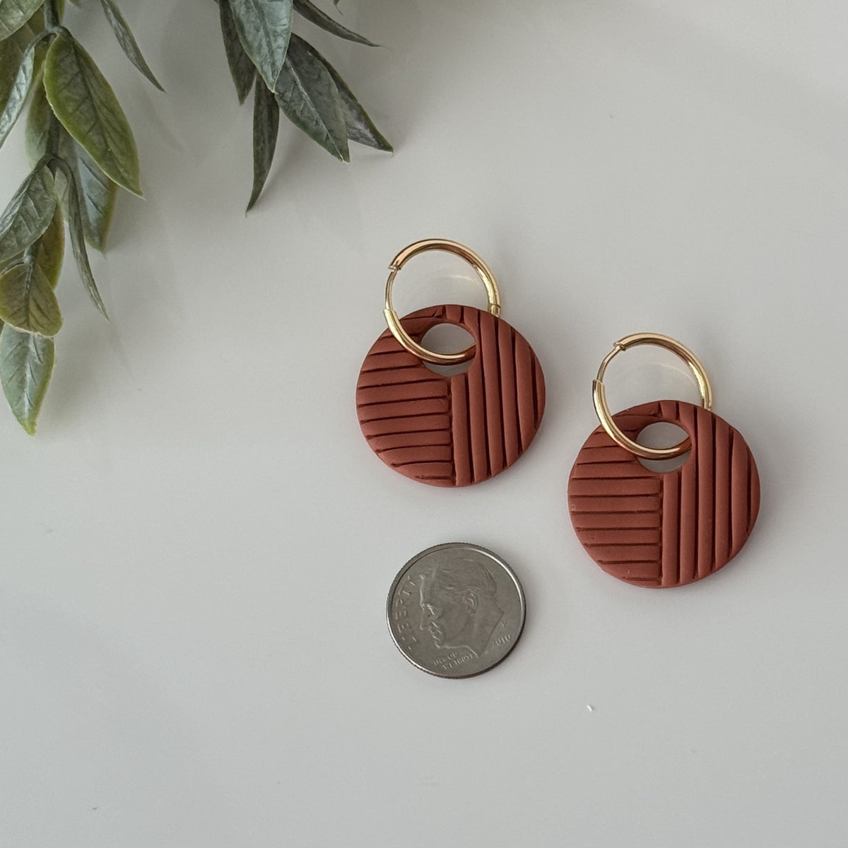 Terracotta round polymer clay earrings on gold hoops